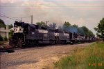 NS 4151 leads a long string of locos and cars out of Glenwood Yard